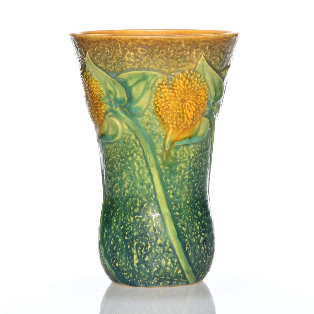 Roseville Sunflower vase, 7 1/8", shape 487-7": Roseville Sunflower vase, shape 487-7. Height 7 1/8 inches. Crisp mold, good color. Tiny glaze nick on rim, otherwise excellent condition.