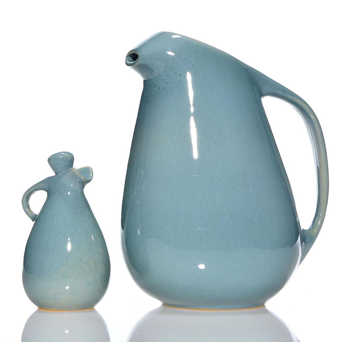 Two Roseville Raymor, 10" pitcher, 5 1/2" cruet, blue: Two Roseville Raymor by designer Ben Seibel in blue gray glaze. 1) 10 inch water pitcher with ice spout, raised marks and shape number 189. Stilt pull beneath. 2) 5 1/2 inch cruet with original stoppe