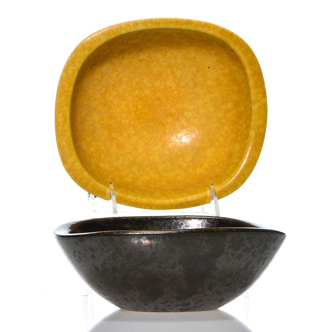 2 Roseville Raymor bowls, sh 28-8, gold, black, 2 7/8": Pair of Roseville Raymor bowls, shape 28-8, one in gold and one in black. Marked on the bottom Raymor Modern Artware by Roseville 28-8" U.S.A. Excellent condition to both. Height is 2 7/8 inches.