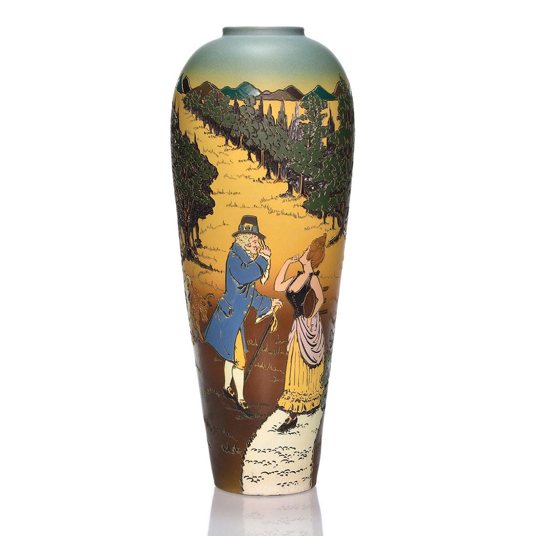 Weller Dickens Ware vase, Milk maiden, cows, house, 16": Weller Dickens Ware vase with a gentleman approaching a milk maiden, toting her footstool walking towards cows in the field, on the hill a stone house is surrounded by mature summer trees, the artist 
