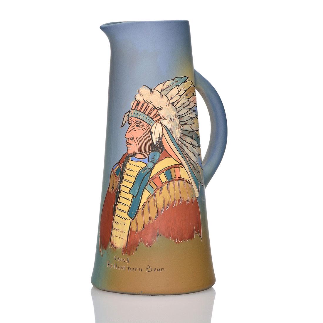Weller Dickens Ware tankard,Hollow Horn Bear,Dunlavy: Weller Dickens Ware tankard with the portrait of Chief Hollow Horn Bear signed by artist Anthony Dunlavy. Height 12 inches. Impressed Weller Dickens Ware, 560 12. Minor glaze nicks on the rim. Crisp c