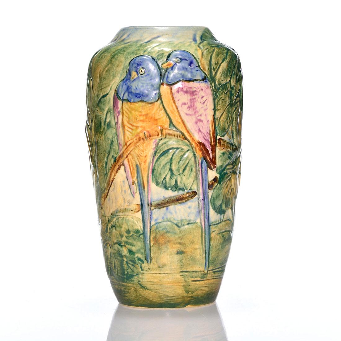 Weller Glendale vase, parakeets, 8 3/4": Weller Glendale vase with two brightly colored parakeets. Marked with the Weller Ware ink stamp and 12X in black slip. There is faint overall crazing. Height is 8 3/4 inches.