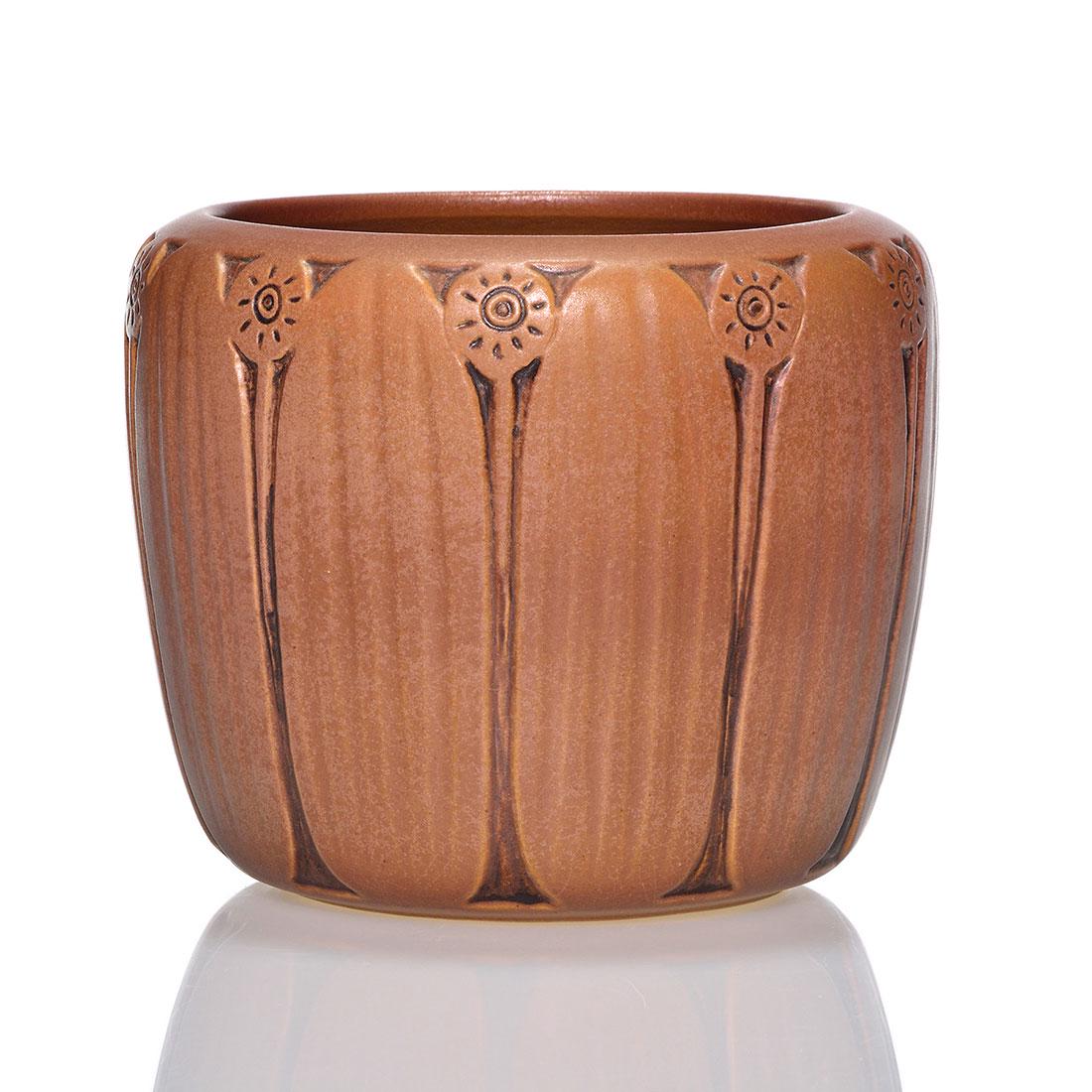 Carved UND vase, sunflowers, Schnell, 1944, 5": Mat finish UND carved vase with stylized Sunflower decoration done by Ruth Schnell in 1944. Marked with the UND circular ink stamp logo and incised Ruth R. Schnell 4/4/44" on the bottom. Height 5 inch