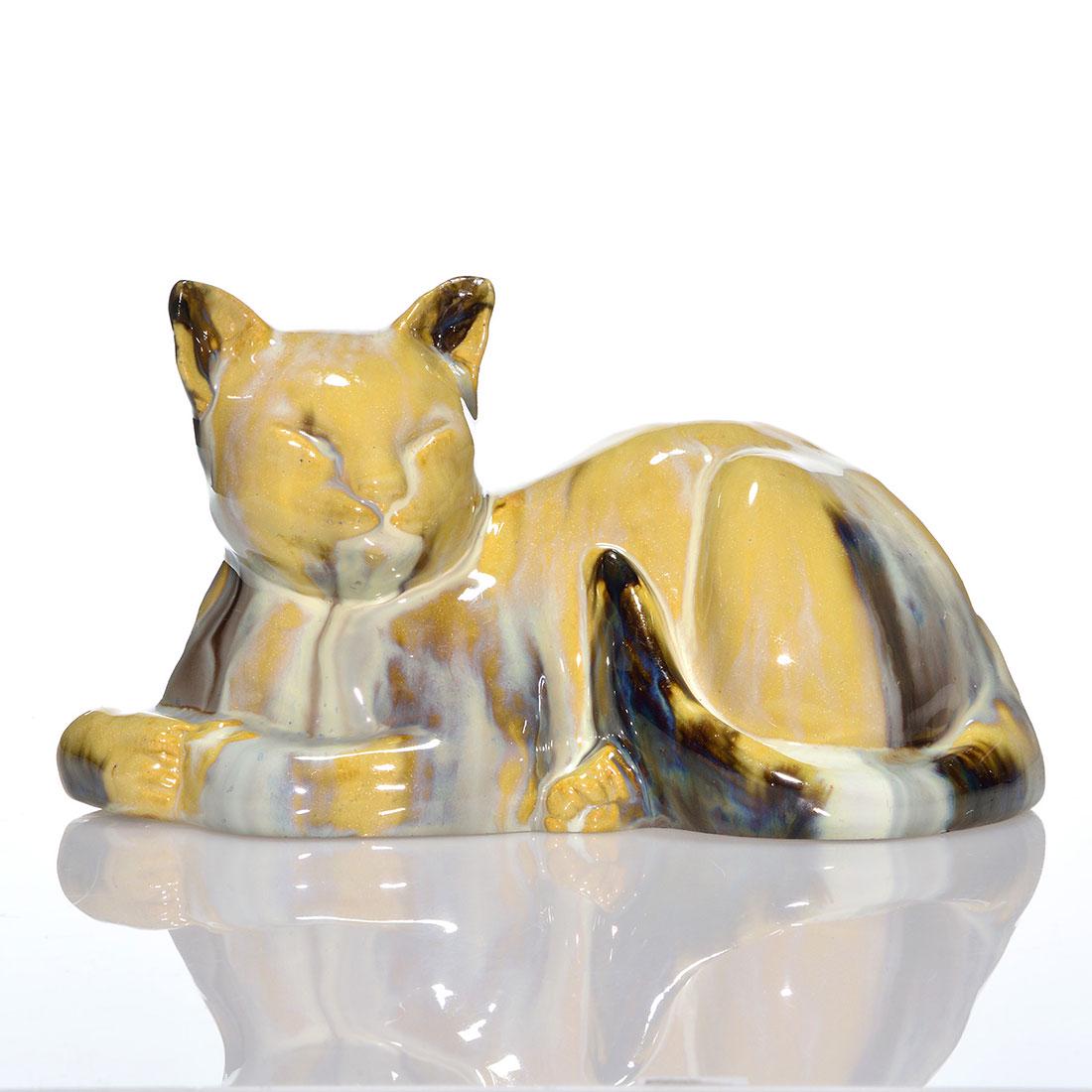 Fulper Flambe' Chinese Sleeping Cat doorstop, 5 1/8": Fulper Chinese Sleeping Cat doorstop, shape 466, covered in a nice flambe' glaze. Marked on the bottom with the Fulper racetrack ink stamp. There has been professional repair to the cat's left ear. He