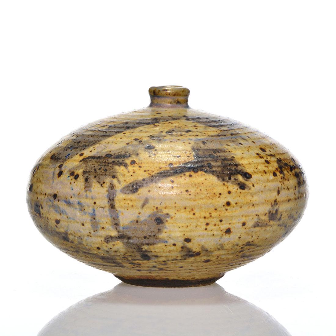 Otto and Vivika Heino squat vase, signed, 4X6": Otto and Vivika Heino stoneware vase, the squat ridged body having dark patterns splashed over tan and gray glazes. Measures 4 inches by 6 inches across. Incised artist marks and logo. Excellent condi