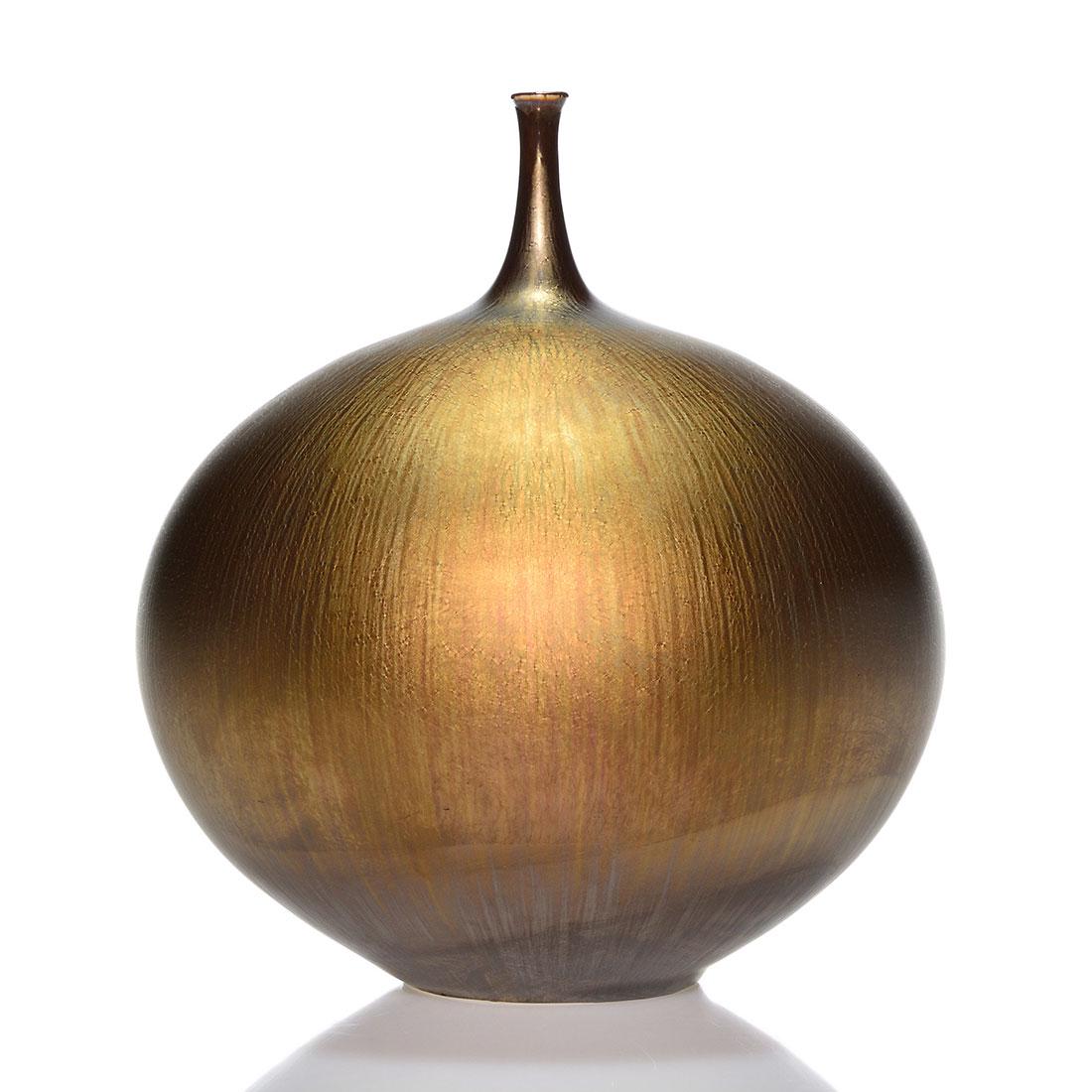 Hideaka Miyamura Studio vase, gold, platinum, 7 1/2": Hideaki Miyamura Studio pottery vase with a slender neck covered by a wonderful golden glaze with warm brown striations over-coating a platinum color glaze. Inscribed with the artist's monogram beneat