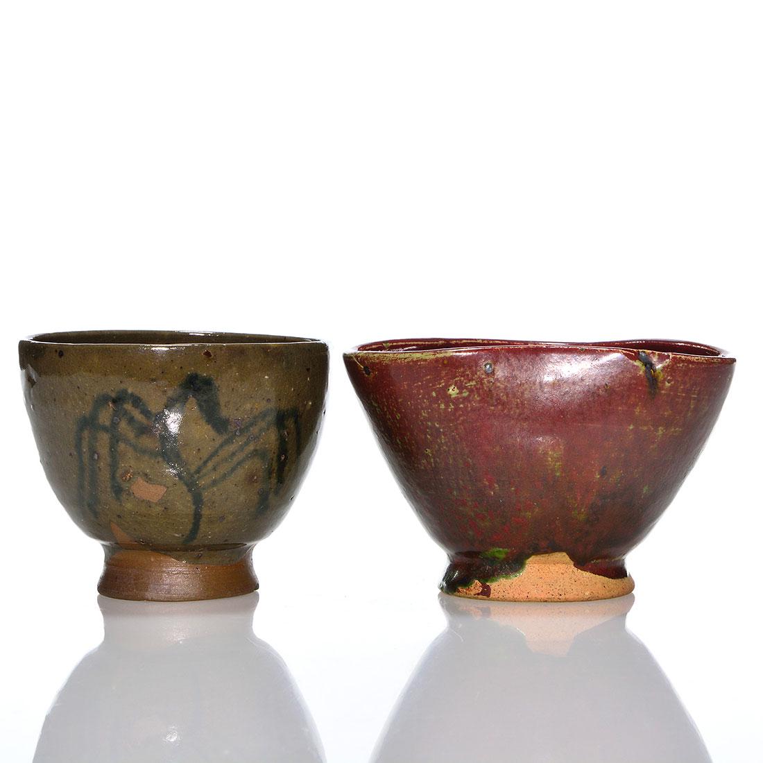 2 Henry Varnum Poor vases, 2 7/8" & 3", both marked: Two Henry Varnum Poor footed vases. 1) 2 7/8 inch clover form with a mat burgundy glaze mottled by spring green. Inscribed HVP 52. Excellent condition. 2) 3 inch ridged with slip designs over an olive