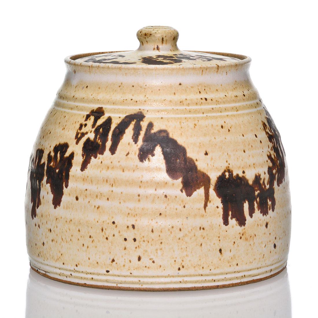 Ken Ferguson covered jar, abstract, 6 7/8": Kenneth Ferguson covered jar with dark brown patterns applied to a tan ground. Ferguson is a Carnegie Institute of Technology and Alfred University grad in ceramics who later taught at Carnegie-Mellon