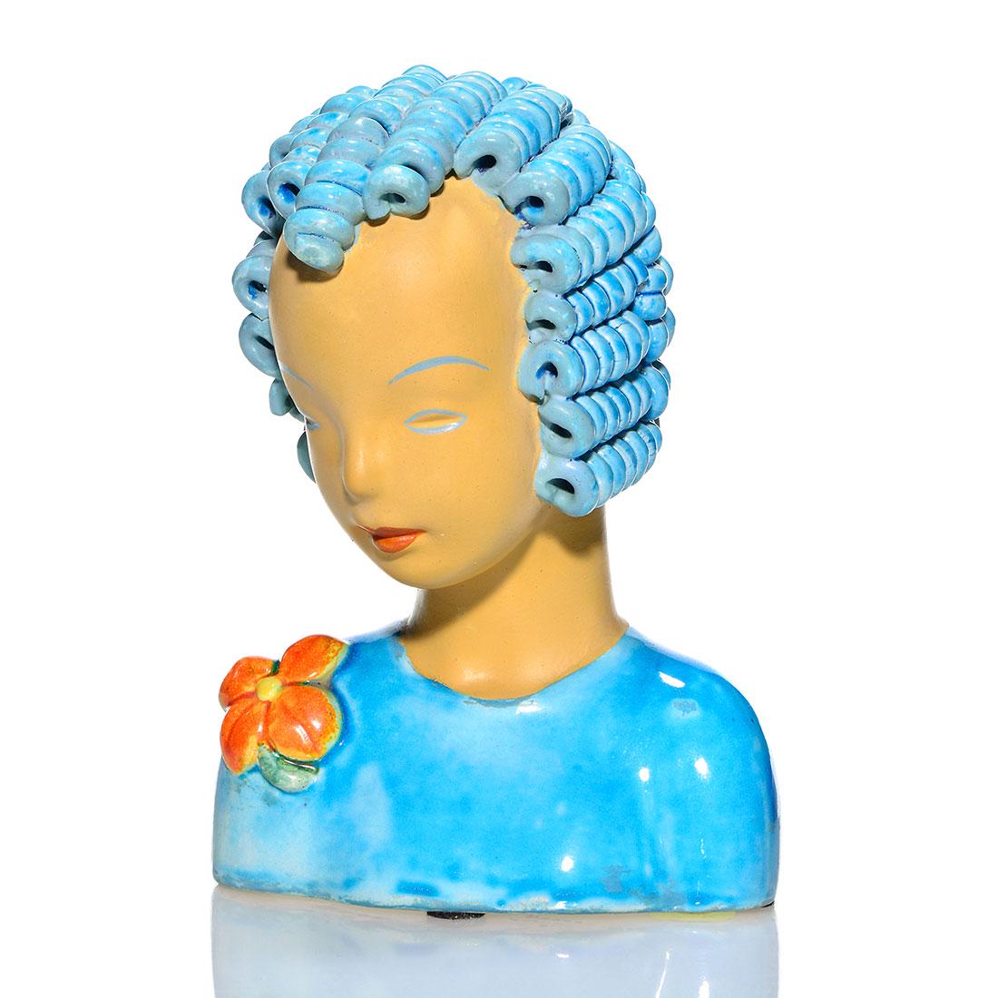 Goldscheider bust of young woman, blue hair, 7 1/2": Goldscheider bust of a woman with blue curly curls and an orange flower on her shoulder. Marked "Goldscheider Everlast Corp." and "Goldscheider USA" in slip on the bottom. Height 7 1/2 inches. Excelle