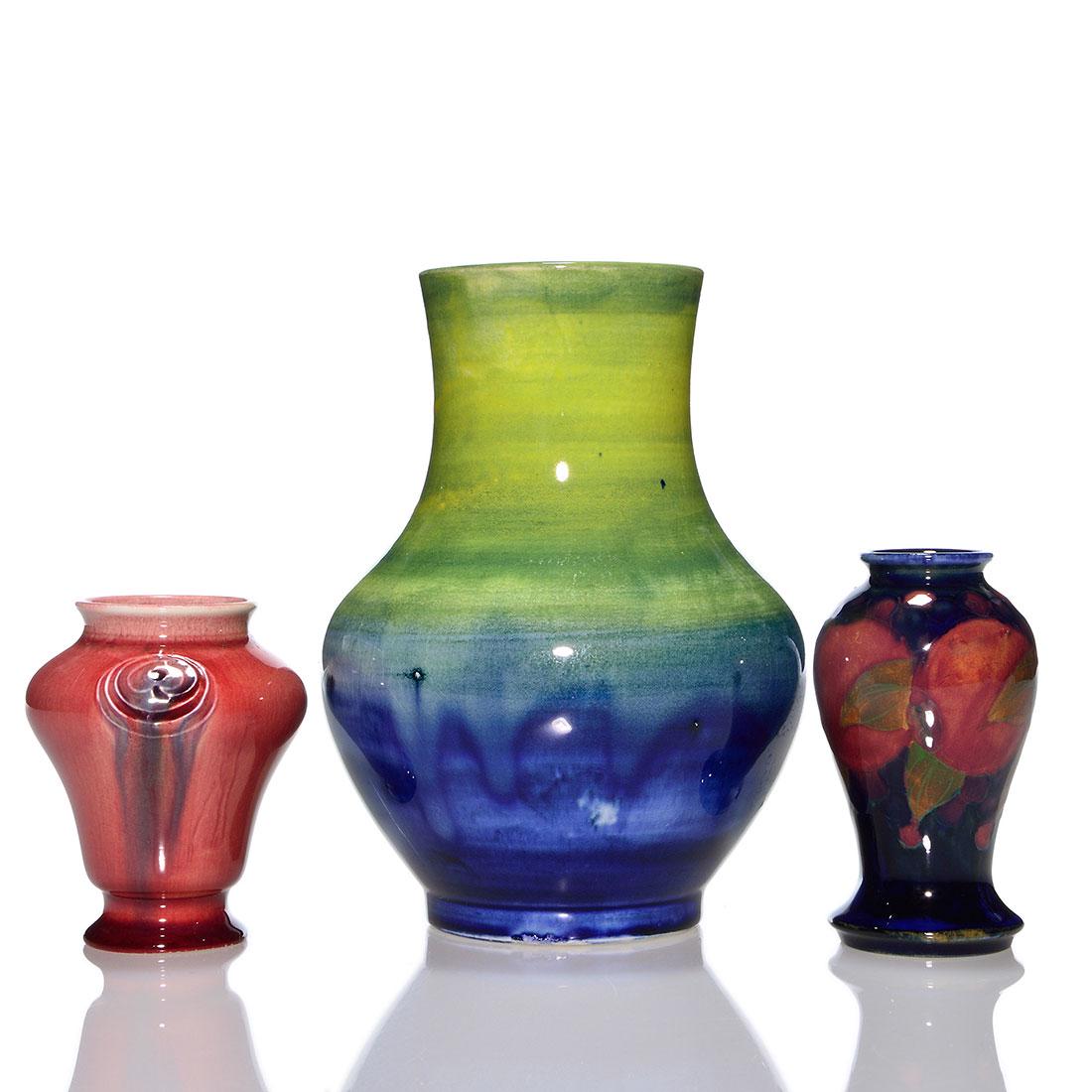 3 Moorcroft vases: Flamminian, Pomegranite, yellow blue: Three Moorcroft vases. 1) 3 1/4 inch red Flamminian Ware, merely incised Wm Moorcroft. 2) 3 3/4 inch Pomegranite, impressed marks. 3) 6 1/2 inch, an atmospheric blend of yellow and cobalt glazes, impr