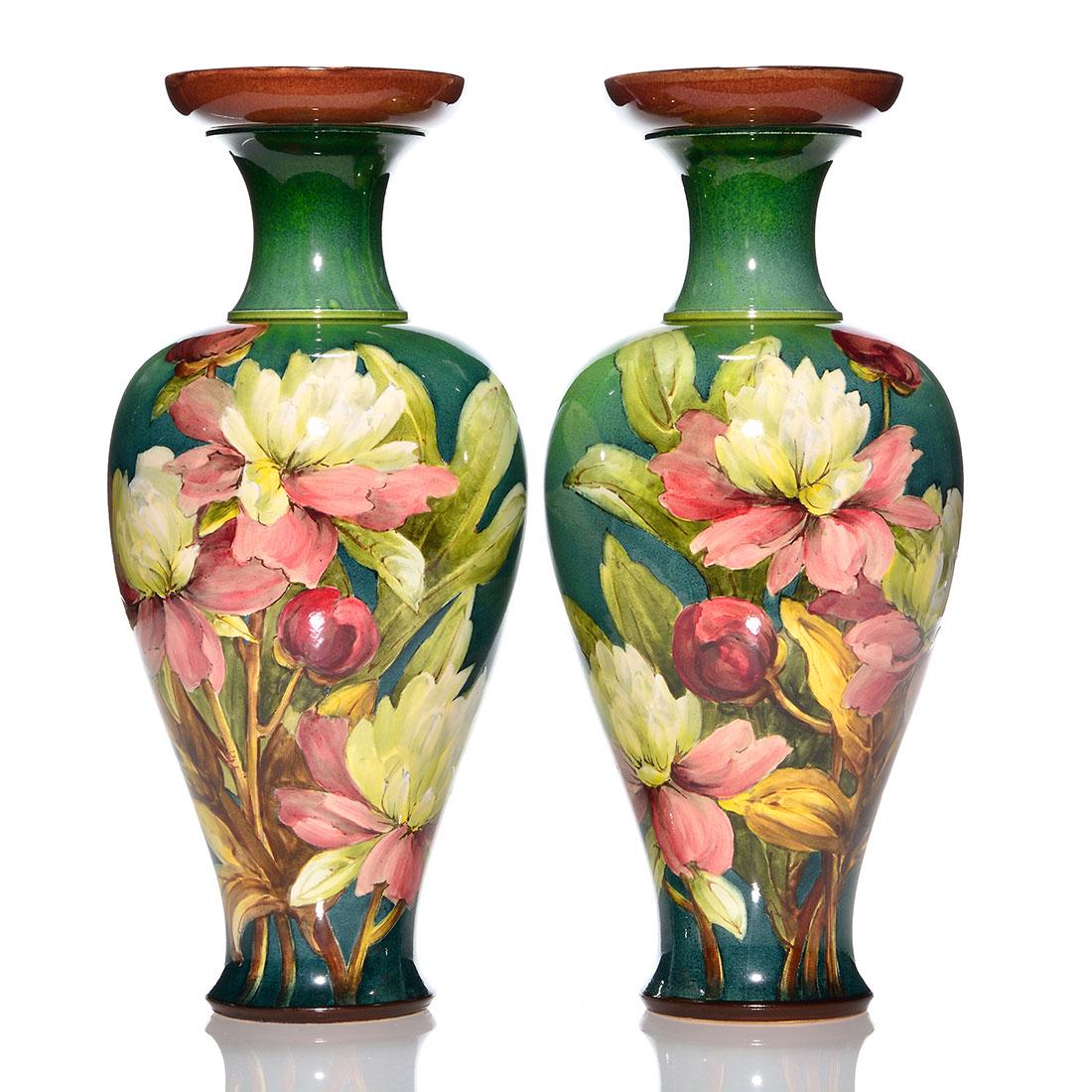 Pr Doulton Lambeth vases, peonies, 13 1/4", K. Rogers: Pair Doulton Lambeth Faience vases each hand decorated by Kate Rogers with pink and white peonies. Heights are 13 1/4 inches. Marked with Doulton's circular stamp and impressed logos plus 2299 and art