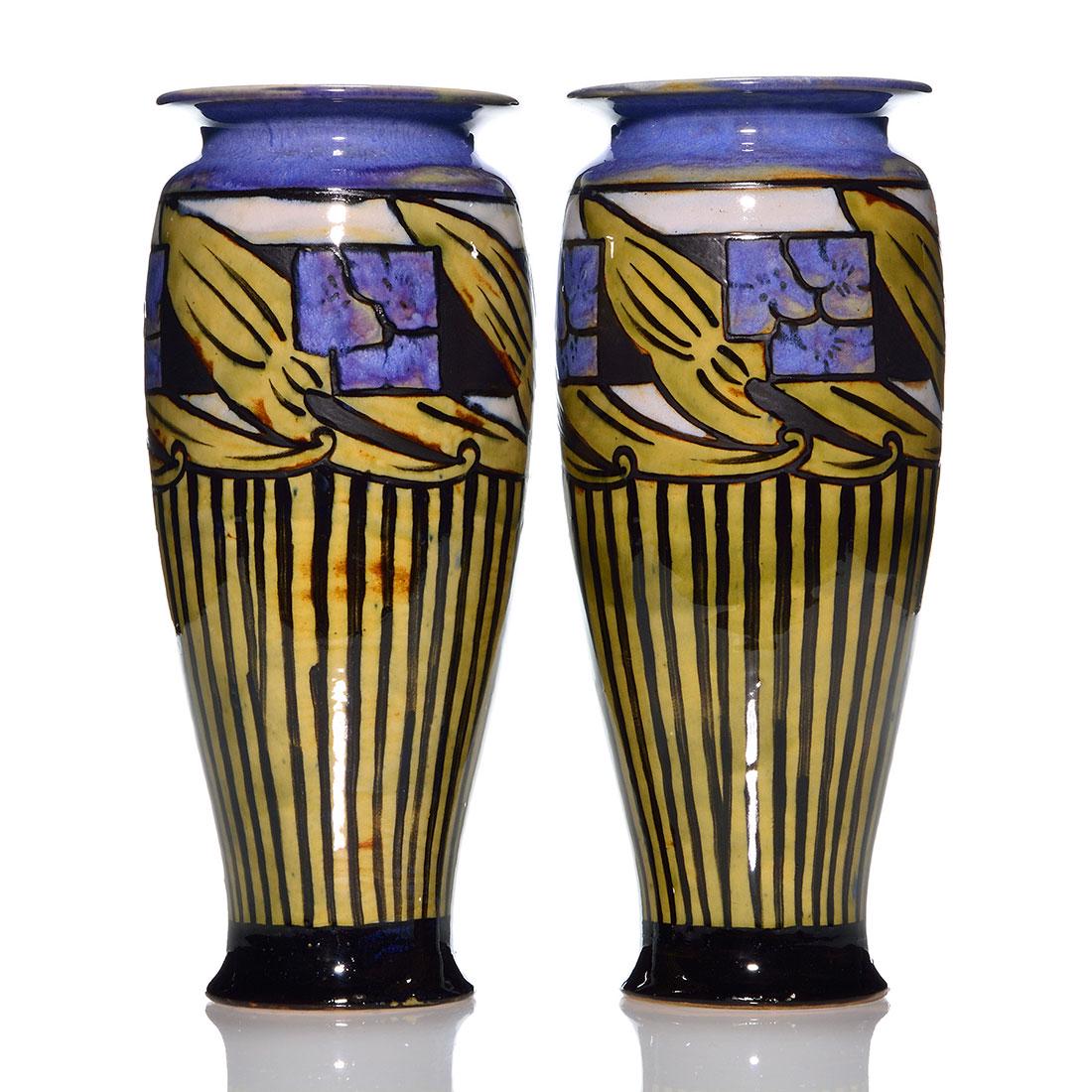 2 Royal Doulton "New Style" vases, 10 5/8": Clean pair of Royal Doulton "New Style" vases with floral and geometric patterns in various colors with a rich blue flambe predominant. Both bear the Royal Doulton logo and shape number 7908. Height o