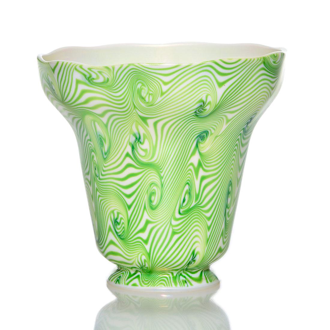 Steuben shade, green King Tut, Roberts #203, 4 1/2": Steuben shade busy with the King Tut design in emerald green over a slightly ribbed Calcite body. Nice pearly white interior. Measures 4 1/2 inches by 4 7/8 inches. Shape 2286. Fleur-de-lis paint stam