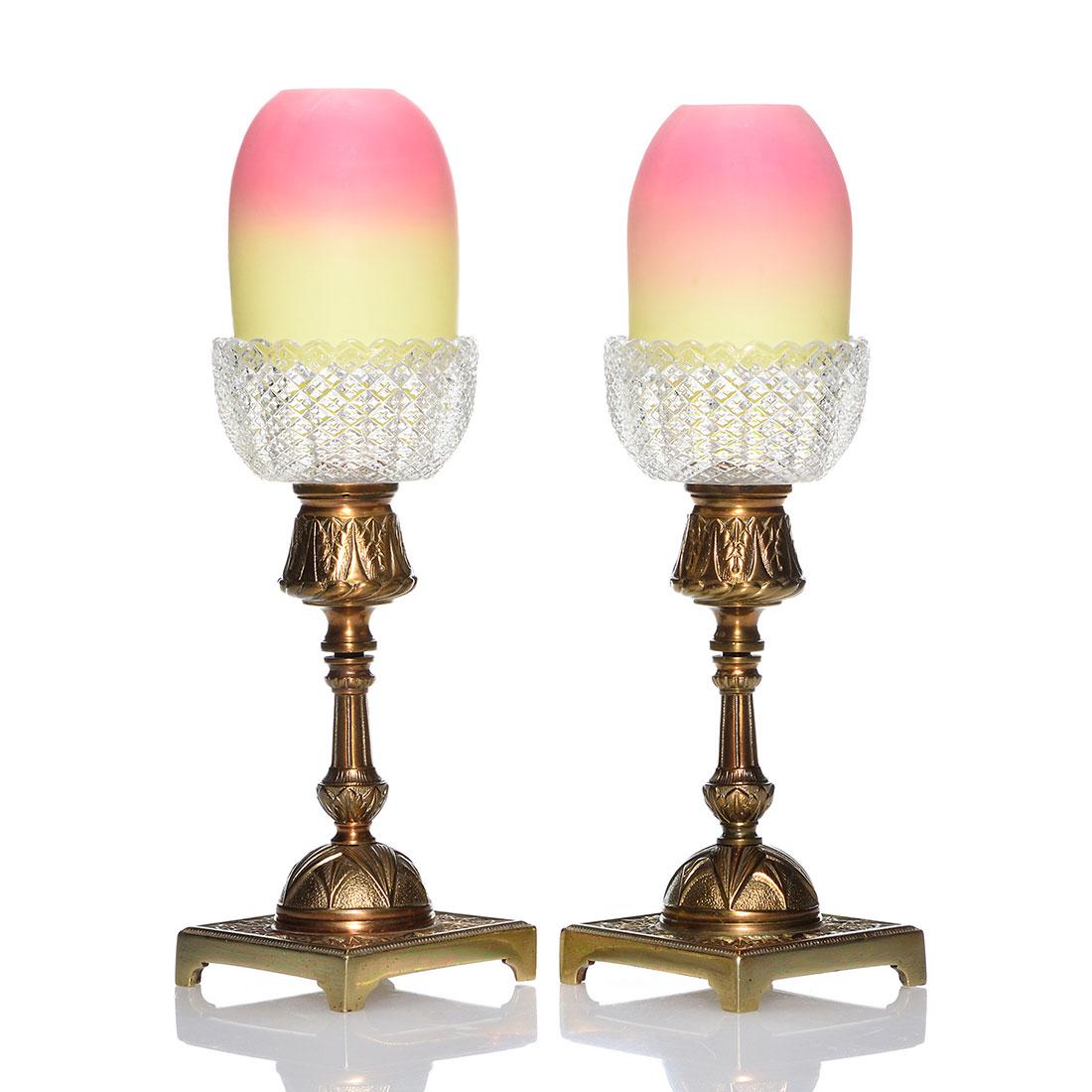 Pr.Thos Webb Pyramid Burmese fairy lamps, brass holder: Pair Thomas Webb & Sons Pyramid Burmese fairy lamps. The 2 3/4 inch Burmese shades rest on S. Clarke inserts impressed with cross cut diamond patterns and have glass pegs that fit into the decorative 