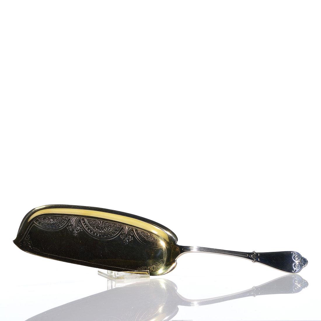 Tiffany & Co sterling fish serving spoon, marked, 13"L: Tiffany & Company sterling fish serving spoon with a gold wash blade and decorative engraved design. Impressed Tiffany & Co., Sterling, M, Pat 1868. Length is 13 inches, the blade is 2 3/4 inches wide