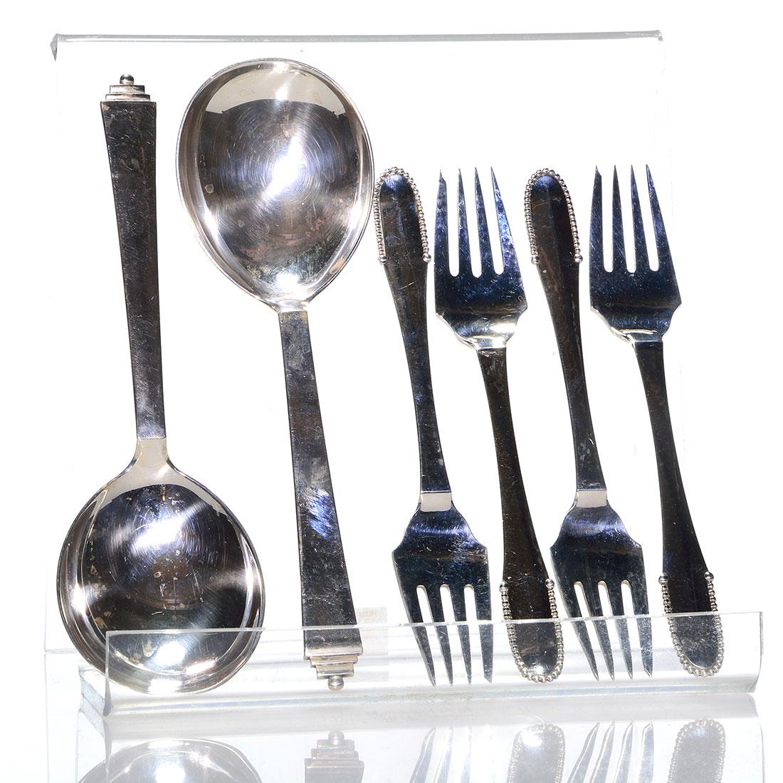 6 Georg Jensen sterling: 2 Pyramid spoons + 4 forks: Six Georg Jensen sterling consisting of a pair of 7 7/8 inch Pyramid pattern serving spoons also four 6 3/4 inch salad forks with beading in the handles. All are impressed with the Georg Jensen logo,