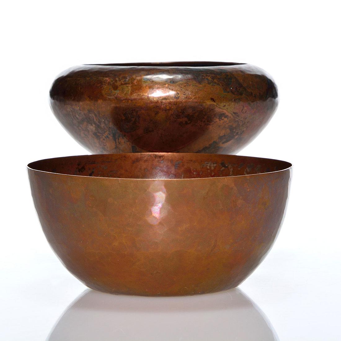 2 Falick Novick hammered copper bowls, 4 1/4": Two Falick Novick small copper Arts & Crafts bowls with hammered surfaces. The inward rim bowl measures 1 3/4 inches by 4 3/8 inches. The other bowl has a silver wash and measures 2 inches by 4 1/4 in