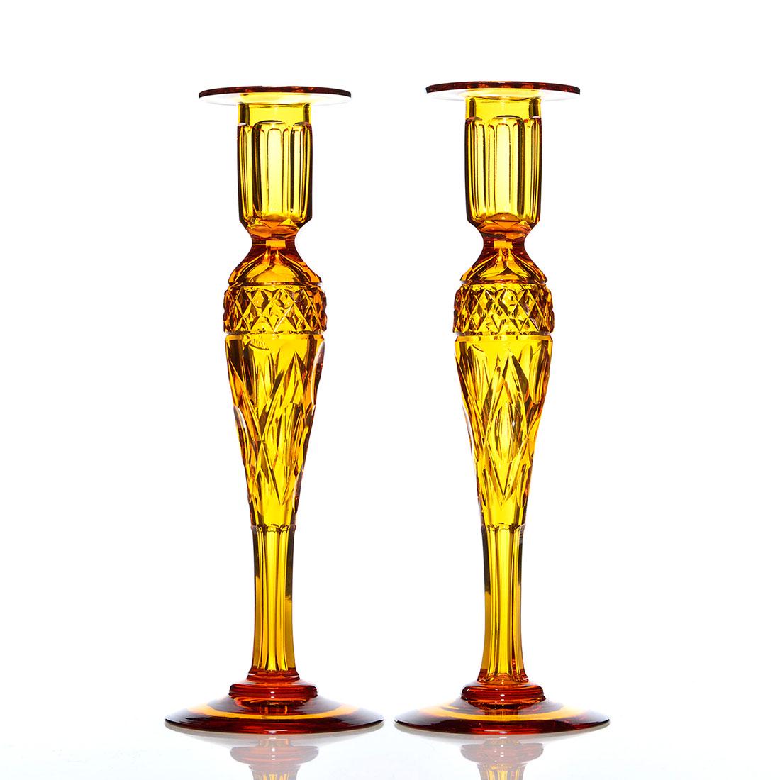 Pr. Pairpoint Adelaide cut glass candleholders, 12": Pair of Pairpoint cut candleholders displaying their Adelaide pattern enclosing a hollow teardrop stem in the Aurora color. Cut and polished holders and stems. Heights are 12 inches. Stylist engraved 