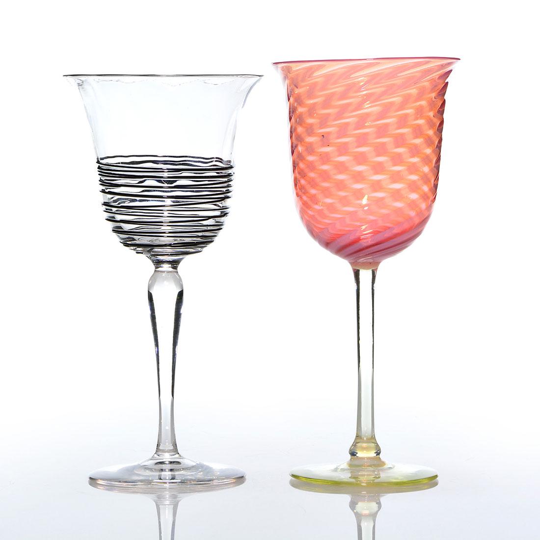 2 Steuben stemware: Oriental Poppy & Black Reed , 8": Two Steuben stemware. An 8 inch Oriental Poppy swirl having a Rockwell Gallery sticker. An 8 inch ribbed crystal with Black reeding with acid fleur-de-lis logo. Excellent condition to both.