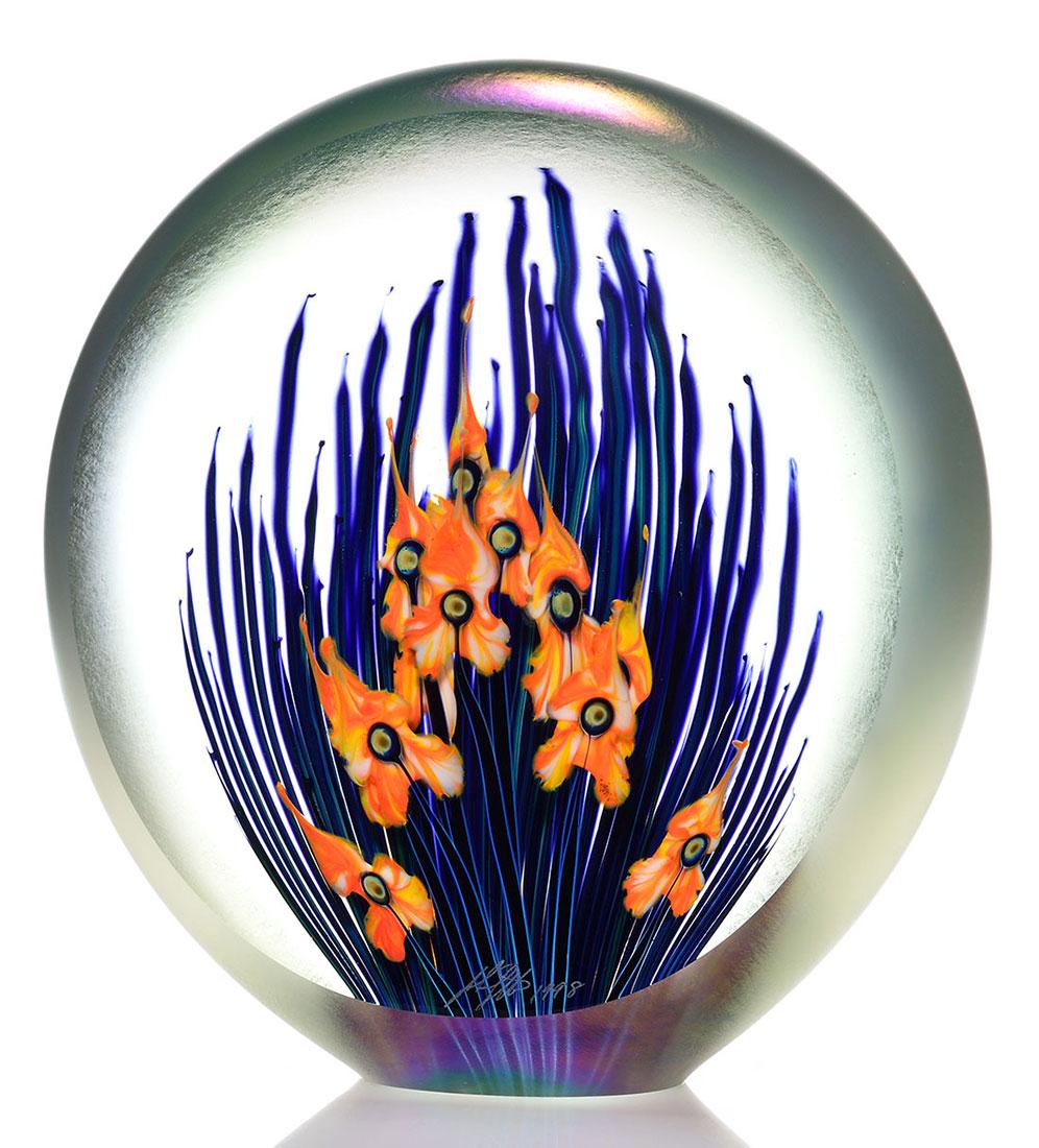 John Lotton magnum moon sculpture, floral, 10 5/8": John Lotton magnum sculpture appearing like a full moon having a polished front revealing a triple layering of orange and white orchid-like flowers backed by a double layer of thin blue black leaf bla