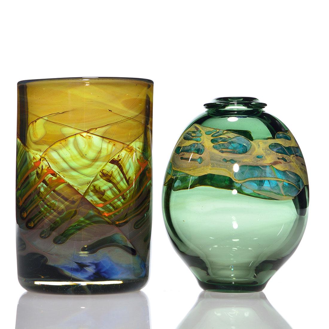 2 Brent Kee Young vases, decorated, 6 1/2" & 6", 1975: Two Brent Kee Young studio vases. 1) 6 inch sage green with a tight fold down rim and encircled by aqua and custard fumes. 2) 6 1/2 inch brown green opal cylinder with bone fillets tinted by orange. B