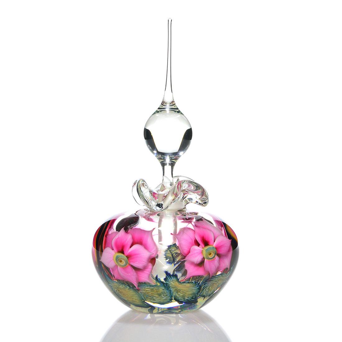 Daniel Lotton Reflective Paperweight perfume, 11": Large Daniel Lotton Reflective Paperweight perfume with pink double layered blossoms and cobalt cream leaves below, the core reflecting the handsome design. Large clear teardrop stopper. Combined heig