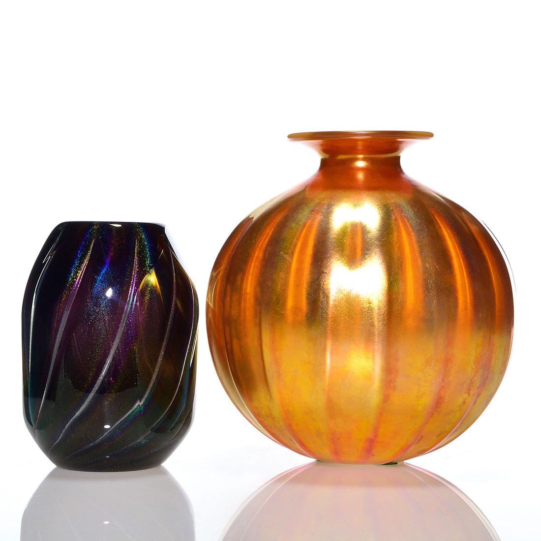 2-Corriea gold vase, 7" + C. Baughn PW vase, 5 1/4": Two Studio vases. 1) Steven Corriea melon ribbed marigold vase, 7 inches, engraved Corriea, CAG 200CA. 2) Early Charlie Baughn paperweight vase with colorful metallic ribs alternating with air trap ve