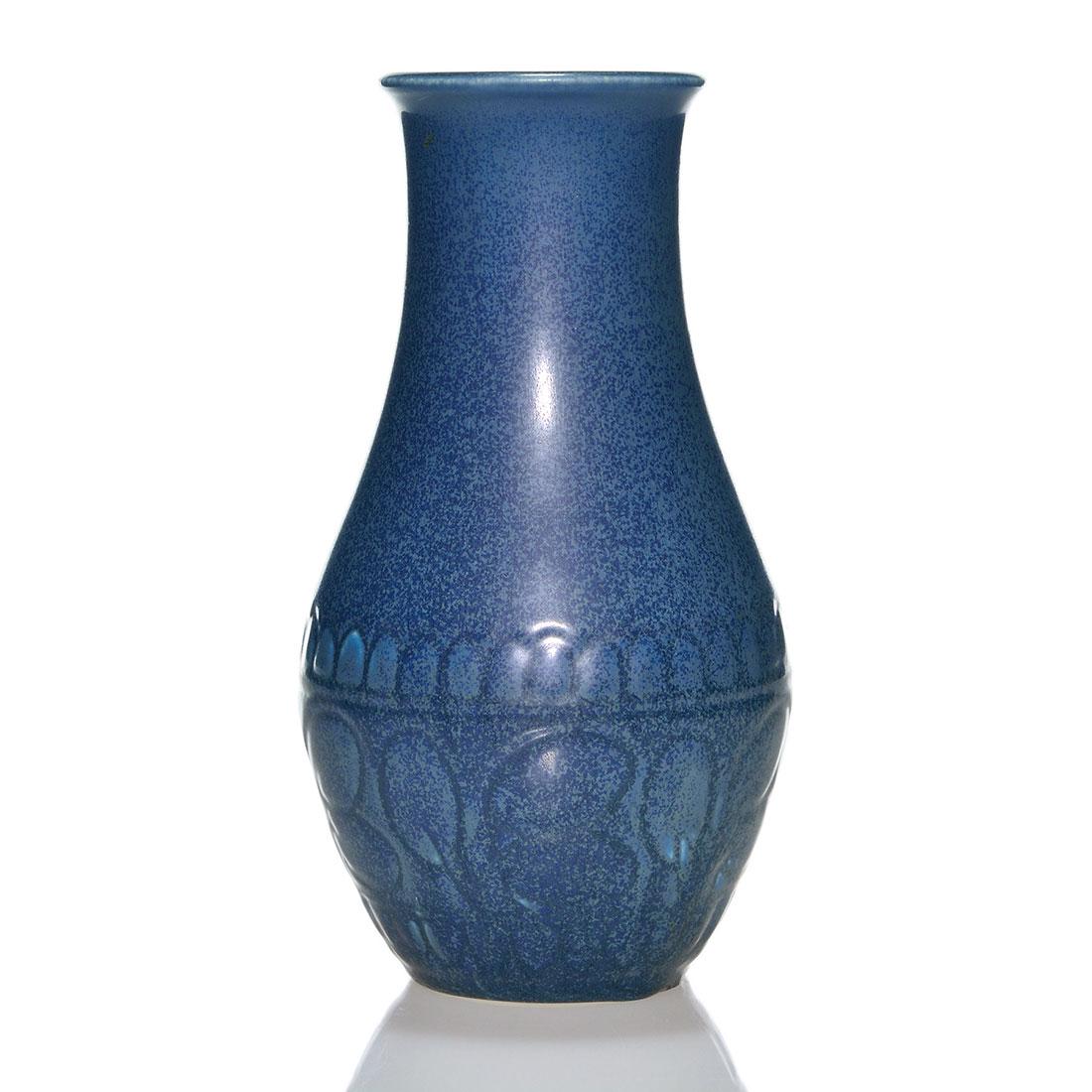 Rookwood production vase, floral, 1927, 2896, 8 1/4": Production vase with molded floral design, cast in 1927 and covered with a dark blue mat glaze with nice crystallization. Marks include the Rookwood logo, date and shape 2896. Excellent original condi
