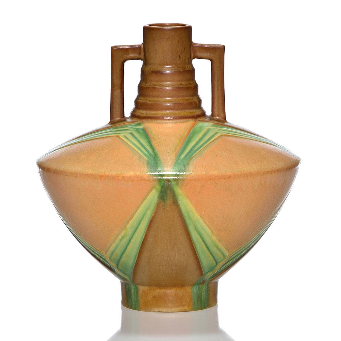 Roseville Futura Football Urn, shape 409-9, 9”: Roseville Futura Football Urn, shape 409-9”. Marked only with a silver foil Roseville Pottery sticker. There is fine overall crazing. Height is 9 inches.