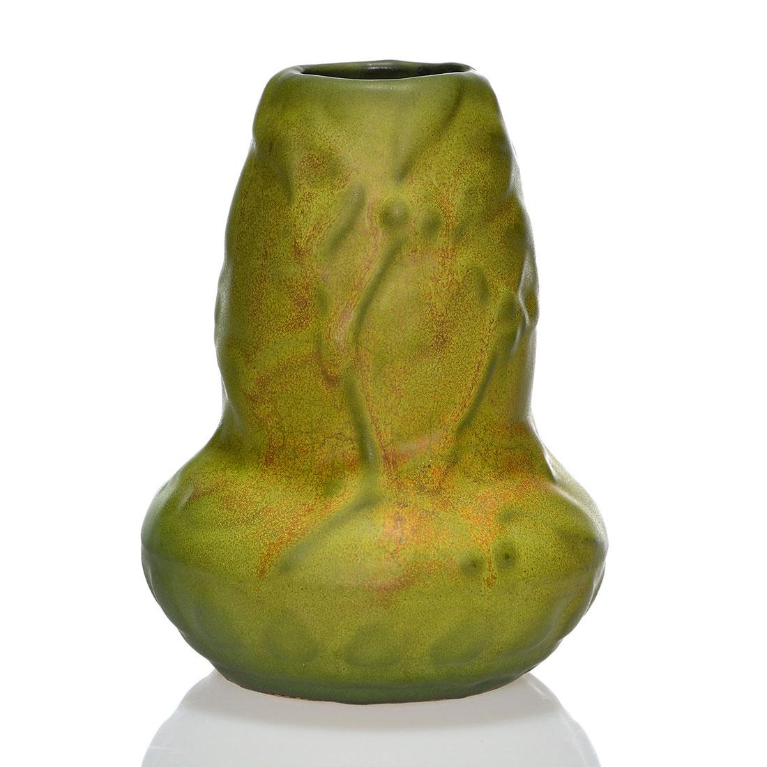 Weller Matt Ware vase in green and rust, 6 1/2”: Unusual Weller Matt Ware vase with subtle shading of light green with rust highlights. The basic form features cast mistletoe design with the mingled mat glazes. Impressed Weller in medium block lette