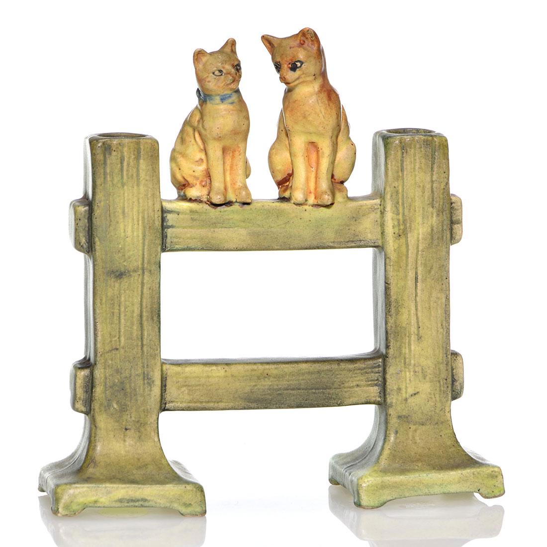 Weller Muskota Cats on Fence double bud vase, 7 1/2": Weller Muskota Cats on a Fence double bud vase, unmarked. There is faint crazing and tiny nicks to one cat's ear and to one of the bases. Height is 7 1/2 inches.