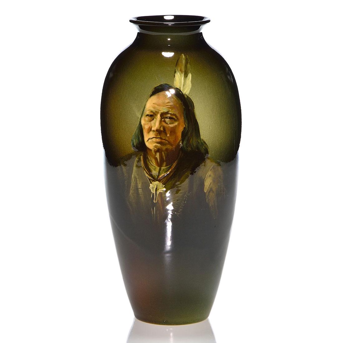 Lonhuda vase, Chief Running Antelope, Sioux, 10 1/2": Lonhuda vase decorated with an image of Sioux Chief Running Antelope by an artist who added their initials, H.D.T., next to the portrait. Marked "Running Antelope" within the portrait and impressed on