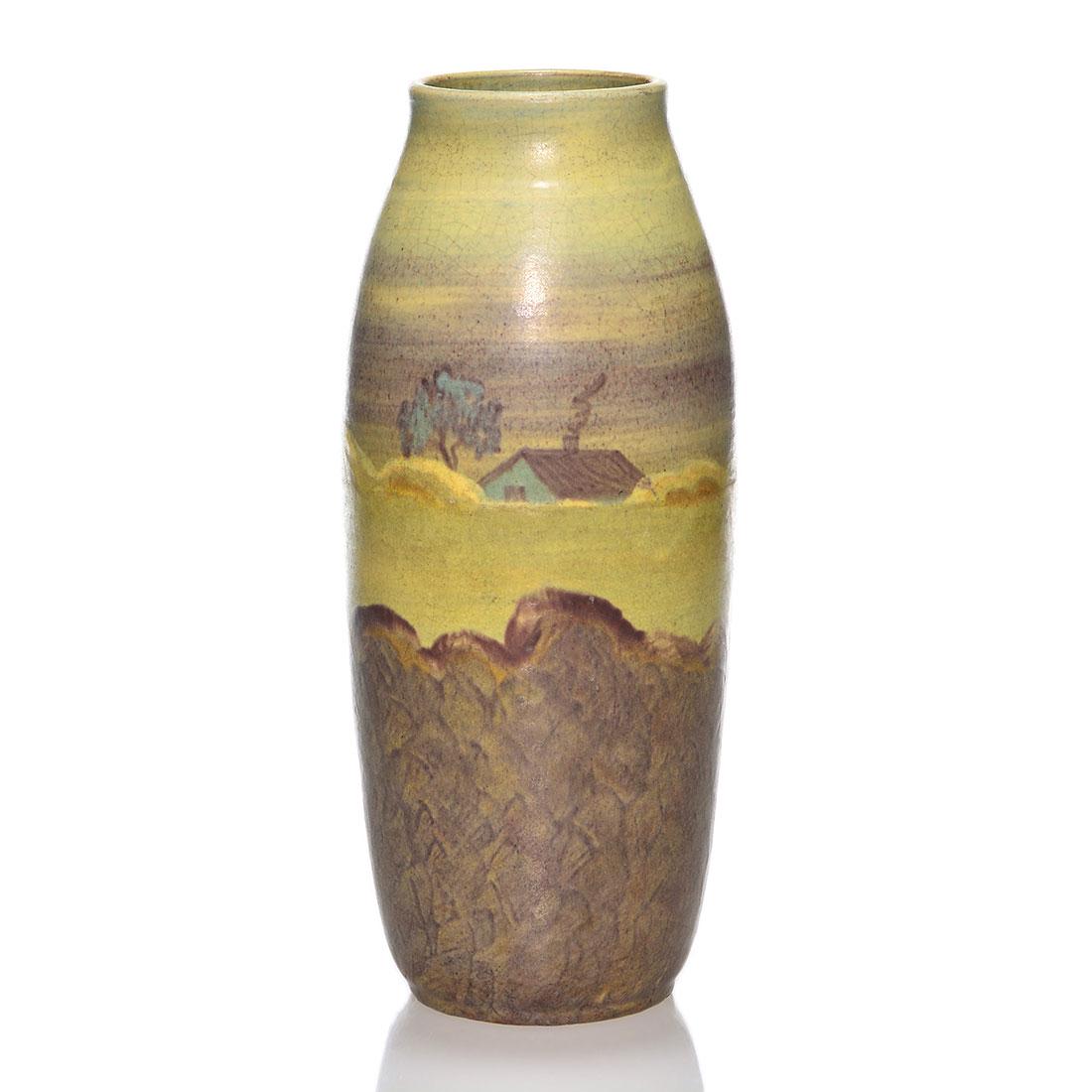 Peters & Reed Landsun scenic vase, house, 9 3/4”: Peters & Reed Landsun scenic vase featuring a house just beyond a ridge with smoke rising from the chimney. Height 9 3/4 inches. Crazing. Tiny glaze nick on the rim. Wonderful bright compatible colors