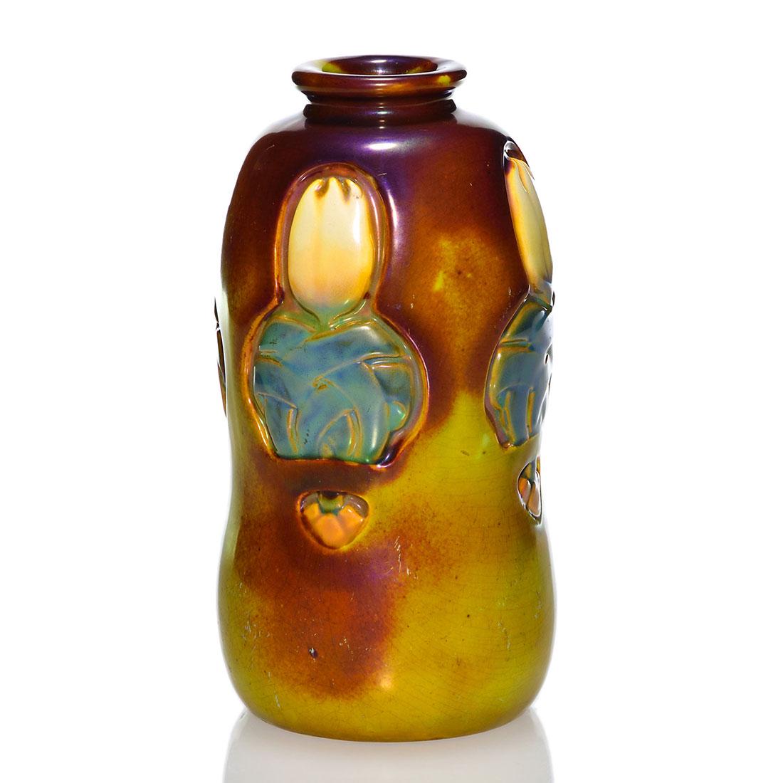 Zsolnay vase, carved flowers, 7 5/8”: Early Zsolnay lustre glaze vase with what appear to be carved tulips and leaves. Marked with the raised Zsolnay circular logo and the impressed numbers 7878 and 50. Height 7 5/8 inches. Some crazing t