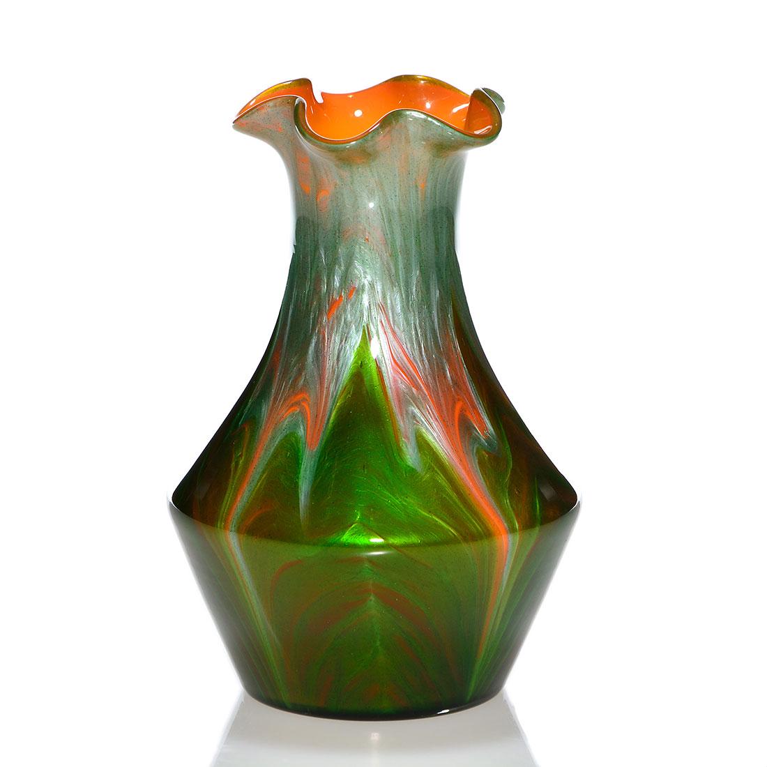 Loetz Titania vase, 6”, Genre 4212, Orange Opal: Loetz Titania vase with green leaf blades pulled upwards through silvery green and cased over an orange opal backdrop, attributed to designer Leopold Bauer. Height 6 inches. Beautiful contrasting colo