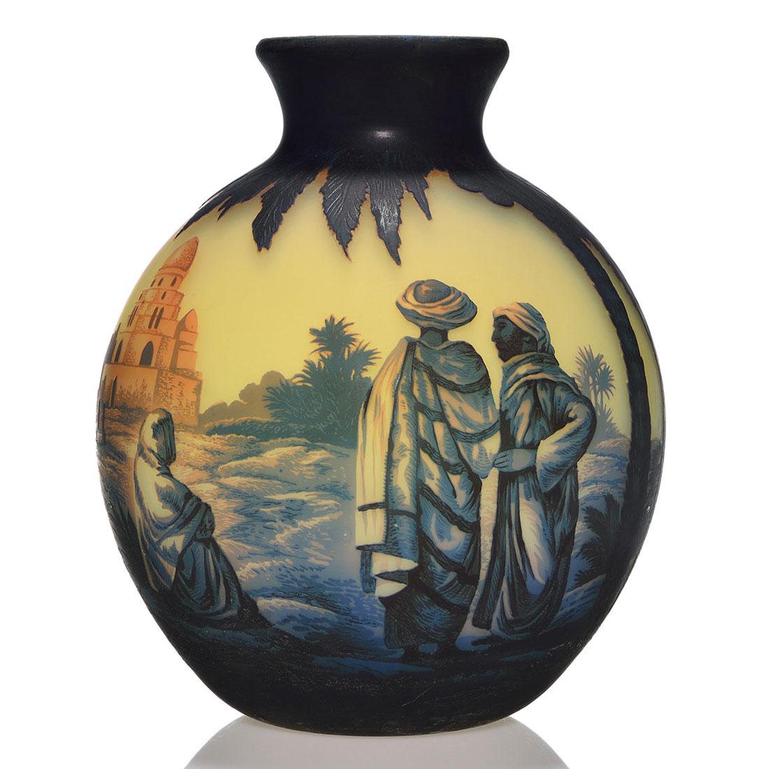 Massive Muller Freres Egyptian scenic, 13 5/8": Massive Muller Freres Egyptian scenic vase featuring two Arab men in conversation and a woman seated nearby, the three sheltered by large palm trees in front of a Mosque. Pyramids are on the back near