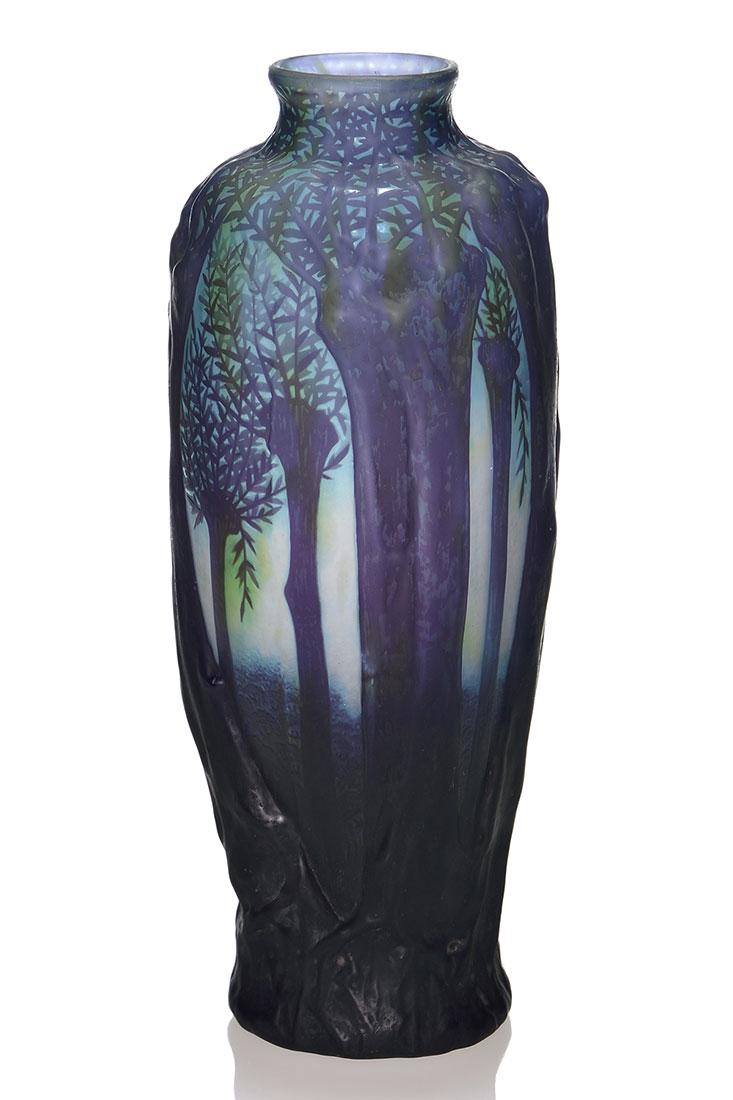Daum Nancy blow-out forest vase, 11 1/4”, marked: Imposing Daum Nancy blow-out vase featuring a mature forest in ultra high relief, their foliage and distant trees finished via cameo providing a natural depth perception. The graphite black woodland i