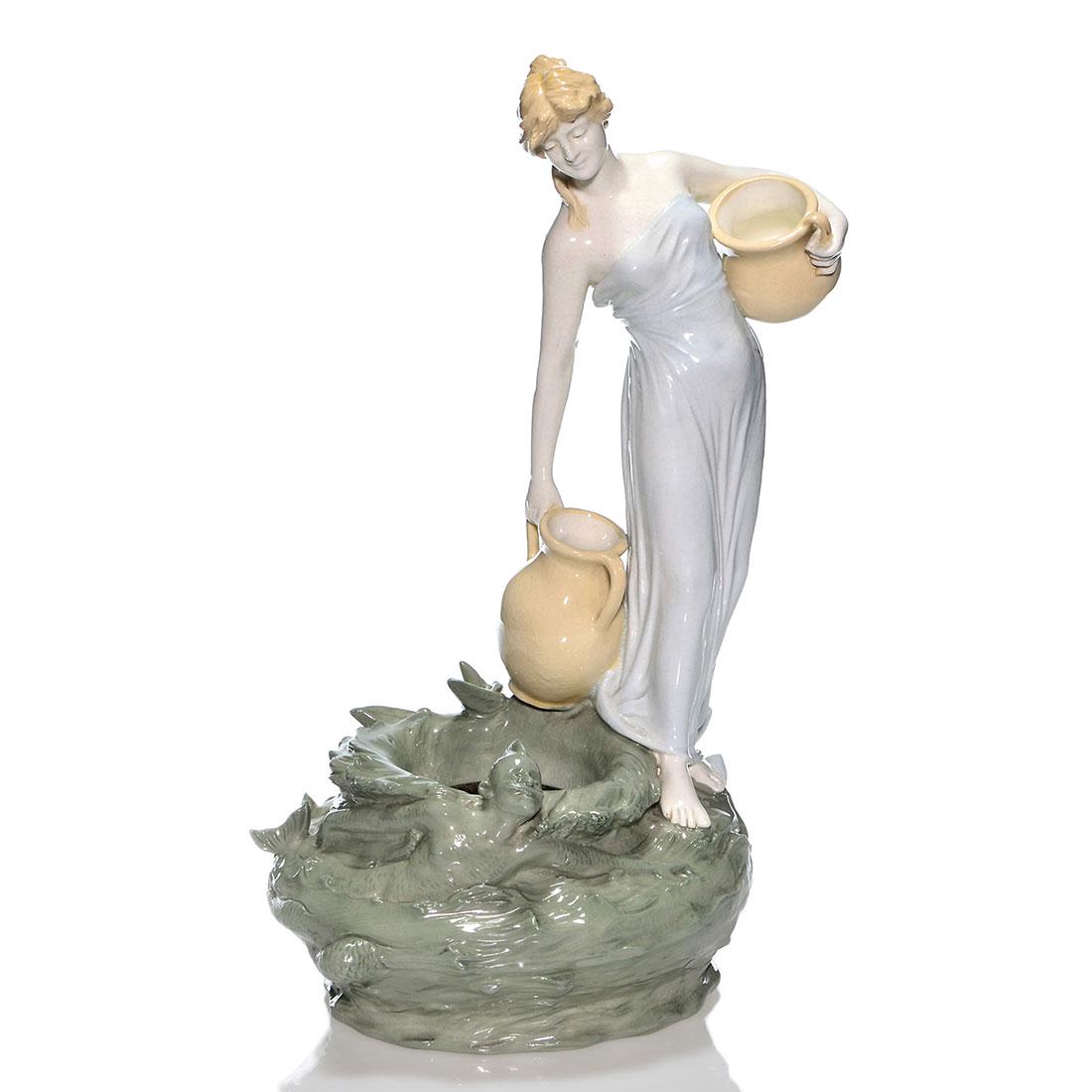 Schoop Maiden & Merman vase, 16” Bernard Bloch: Theodore Schoop high glaze, a figural vase of a barefoot maiden lugging two vases at the waters edge with the appearance of a merman for Bernard Bloch, Austria. Measures 16 inches and 9 inches across.