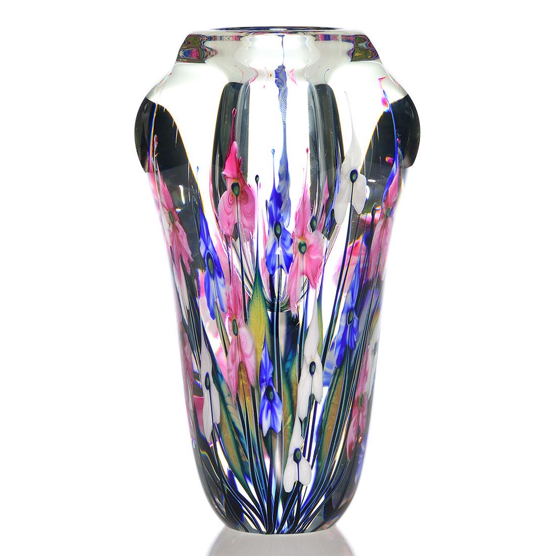 John Lotton Reflective PW vase, patriotic, 11": John Lotton Reflective Paperweight vase surrounded in 5 layers with red, white and blue trilliums backed by yellowish blue foliage. Height 11 inches. Engraved John Lotton, with the year 2003. Weight i