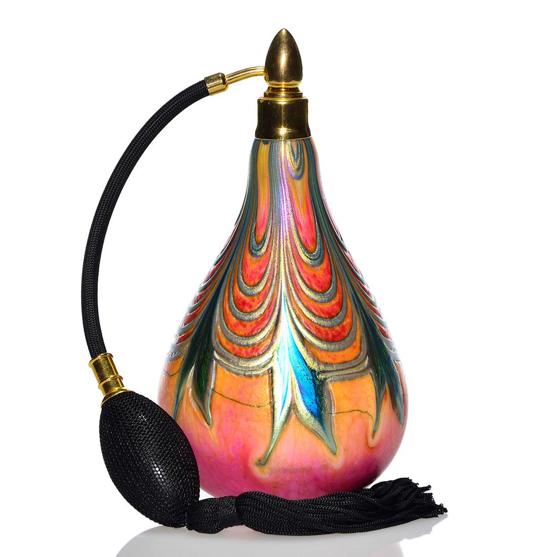 Daniel Lotton atomizer, foliage & swags, 7 1/2": Daniel Lotton atomizer with aurene blue split foliage connected by silvery swags over a brightly shaded coral and pink body. Height 7 1/2 inches. Artist engraved with the year 1992. Wonderful colors. 