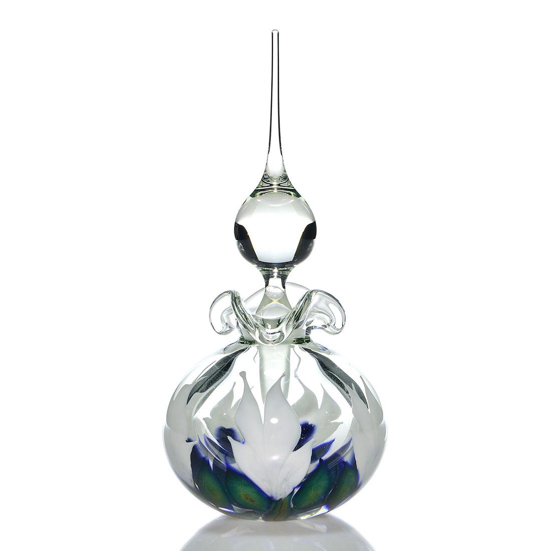 Daniel Lotton stoppered perfume, cyclamen, 10 1/4”: Daniel Lotton stoppered perfume decorated with white cyclamen blossoms and blue green foliage. Height to the teardrop stopper tip is 10 1/4 inches. Artist engraved with 1998 year. Excellent beautiful 