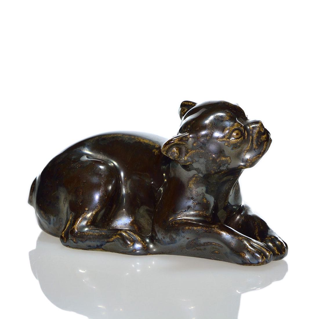 Rookwood Lying Down Butch pw, Nubian Blk, 6481, 2 1/4": Lying Down Butch paperweight, a Louise Abel design based on a dog E.T. Hurley owned, cast in 1934 and covered in the Nubian Black glaze. Excellent original condition. Size is 2 1/2 inches high by 4 1/