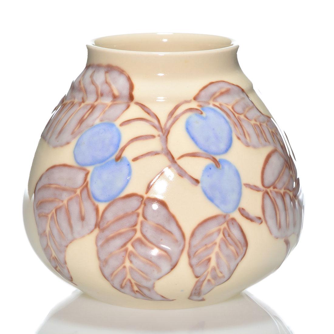 Rookwood Porcelain vase, plums, Jensen, 1944, 7 1/4": Porcelain vase decorated with branches filled with plums, the work of Jens Jensen in 1944. Marks include the Rookwood logo, date, shape 6877 and Mr. Jensen's monogram in dark slip. Excellent original