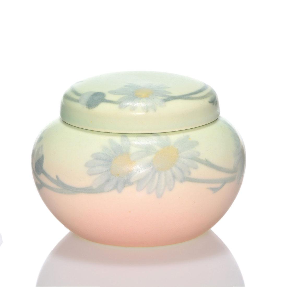 Rookwood Vellum covered jar, LNL, 1907,622 C, 3 1/8": Vellum Glaze lidded jar decorated with daisies by Elizabeth Lincoln in 1907. Impressed with the Rookwood symbol, the date, shape 622 C, a V for Vellum and the designation X 1889 X and incised with ano
