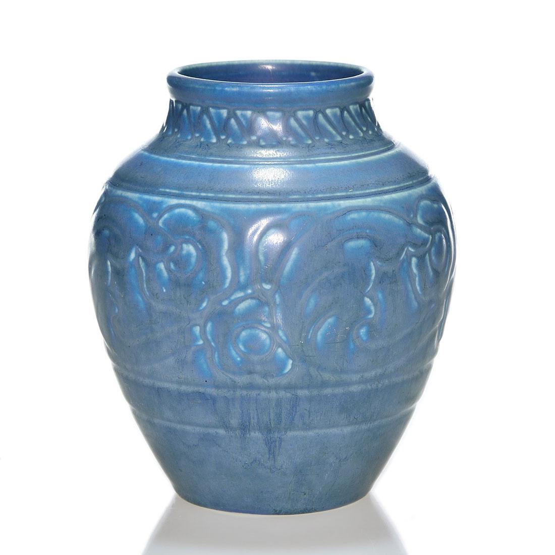 Rookwood production vase, floral, 1926, 2865, 5 3/4": Production vase with molded floral design, cast in 1926 and covered with dark over light blue mat glazes. Marks include the Rookwood logo, date and shape 2865. Excellent condition. Height is 5 3/4 inc