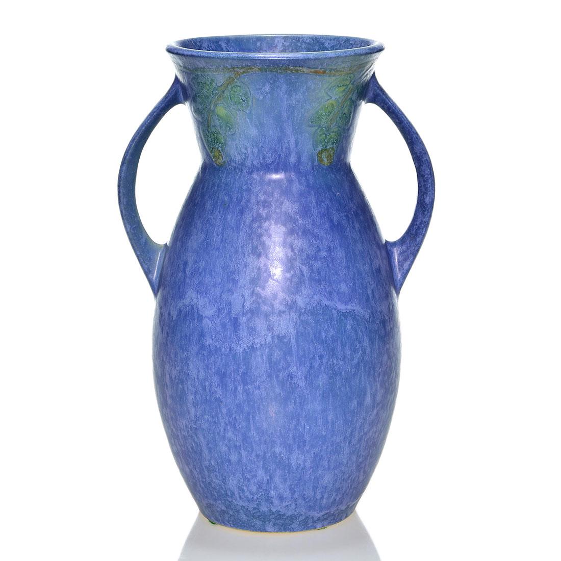 Roseville Windsor vase, shape 554-10, blue, 10 1/2: Roseville Windsor vase, shape 554-10, in blue. Marked with a silver foil Roseville Pottery sticker. There is a tiny nick at the rim. Height is 10 1/2 inches.