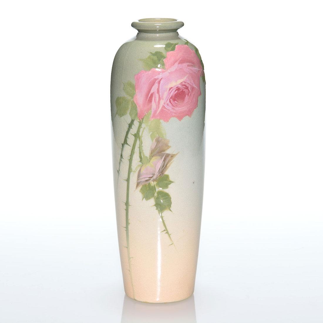 Weller Eocean vase, roses, William Stemm, 11”: Weller Eocean vase decorated with pink roses by William Stemm who signed the side of the vase in green slip. Incised Eocean Weller on the bottom. There is fine overall crazing. Height is 11 inches. El