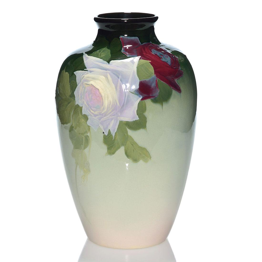 Weller Eocean vase, wild roses, McLaughlin, 12 3/4: Weller Eocean vase decorated with two large wild roses painted by Sara McLaughlin who added her signature near the base in white slip. Incised Weller Eocean on the base. There has been professional re