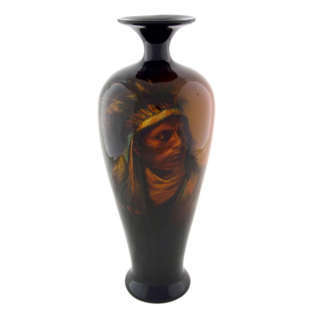 Owens Utopian Indian Portrait, McCandless, 14 1/8”: Portrait of Native American High Hawk done by Cora McCandless for J.B. Owens in Utopian glaze. Artist signature and name of the sitter done in orange slip. Marked Owens Utopian 1116 on the underside.