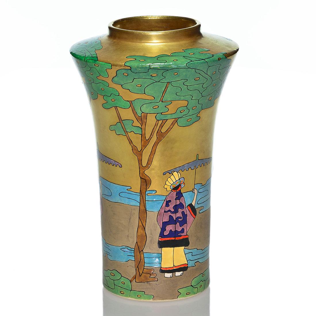 American Satsuma vase, Geisha/parasols, 9 1/2: American Satsuma scenic vase enamel decorated by Eva Powell with repeating Geishas grasping parasols overlooking a body of water beneath foliaged trees. The spacious sky is lavished with a costly appl